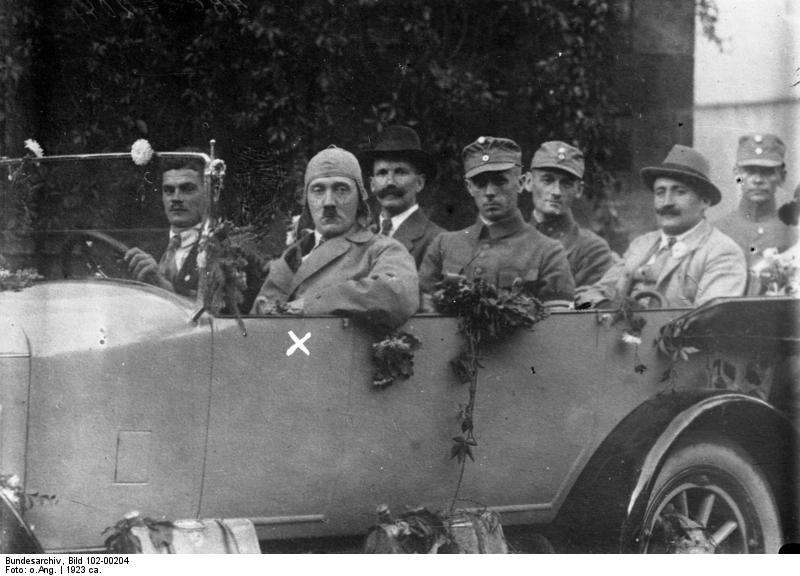 Early party members pose with Hitler in his car at the Deutscher Tag in Hof